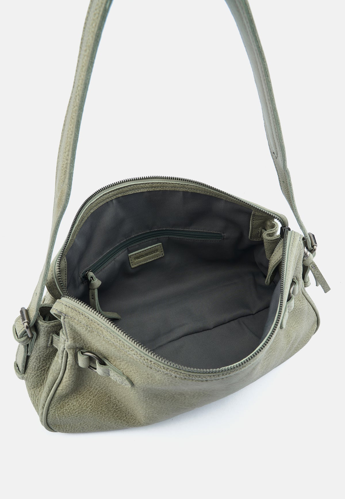 Innenansicht: hellgrüne Schultertasche mit Reißverschlussinnenfach.
